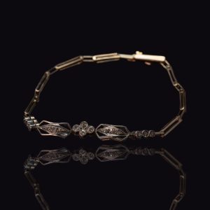 14 krt. gouden Art Deco armband met diamanten in zilver gezet