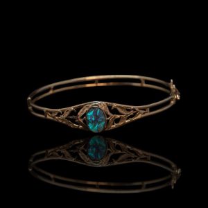 14 krt gouden stijve armband met zwart opaal